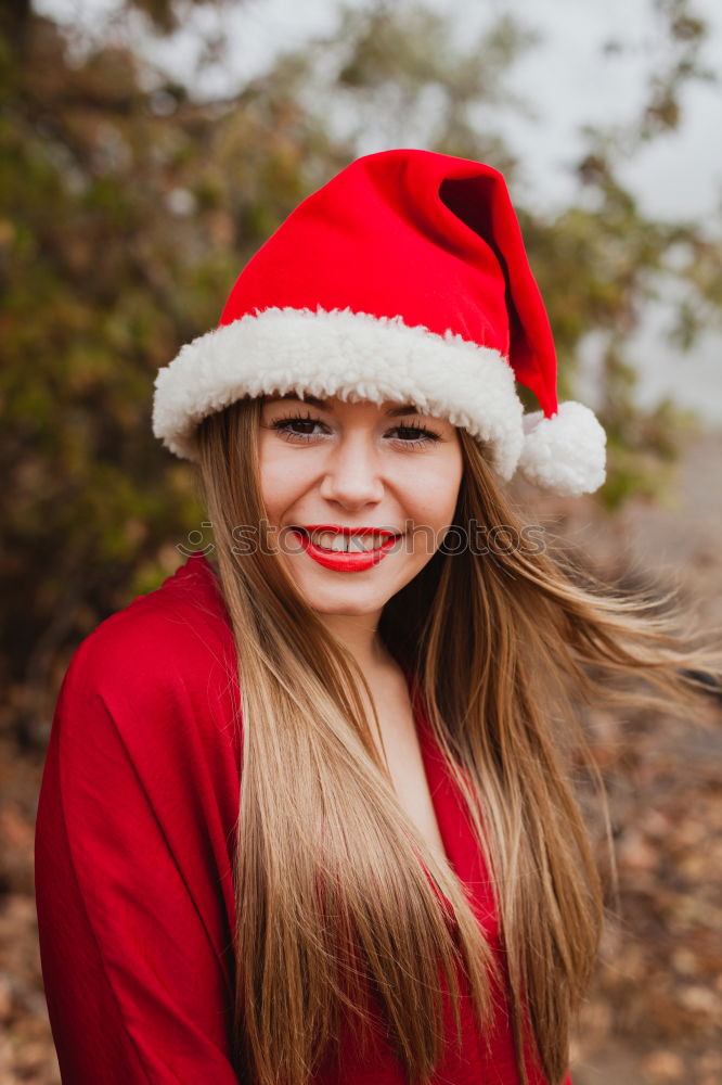 Similar – Image, Stock Photo Young woman with Christmas hat in the forest