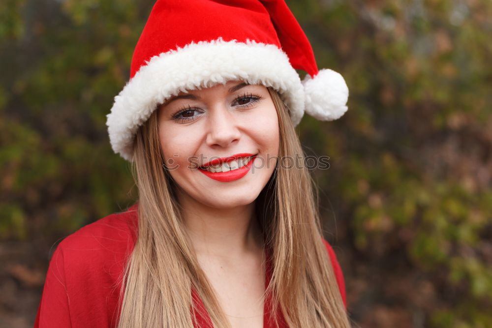 Similar – Image, Stock Photo Young woman with Christmas hat in the forest