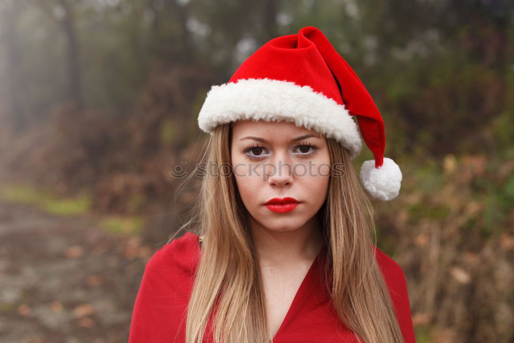 Similar – Image, Stock Photo Young woman with Christmas hat in the forest