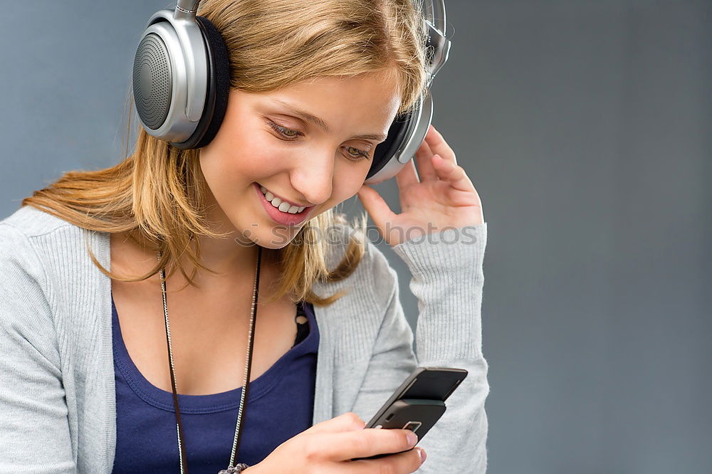 Similar – Image, Stock Photo young woman listening to music with wireless bluetooth headphones and mobile smart phone