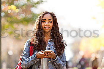 Similar – Image, Stock Photo Young Arab woman texting with her smart phone