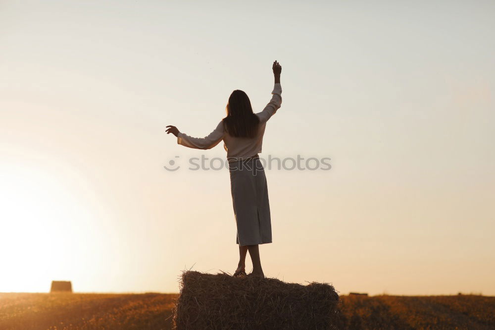 Similar – Young woman with her arms raised to the sky