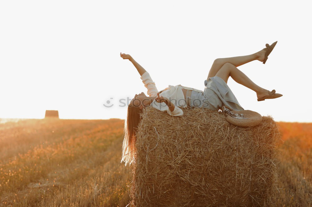 Similar – Image, Stock Photo Hand holding a cowboy hat over a field of wheat