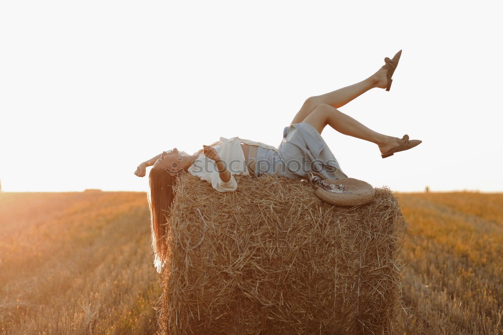 Similar – Woman in big round hat in middle of wheat field