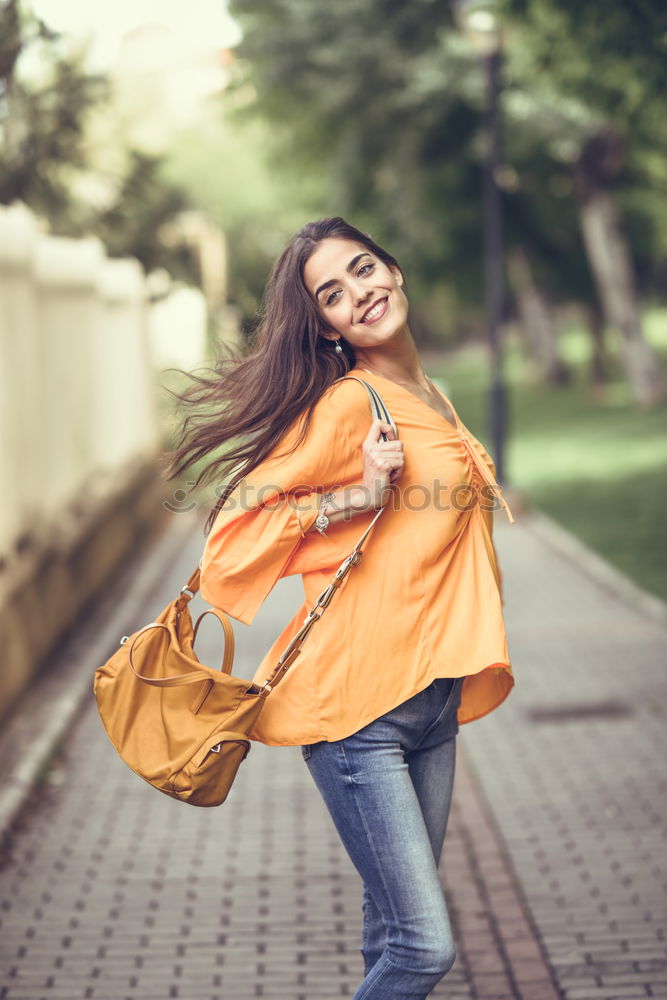 Young woman with moving hair wearing casual clothes