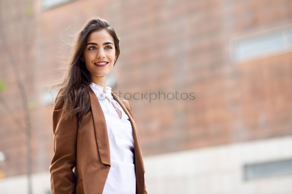 Similar – Stylish woman in jacket talking phone