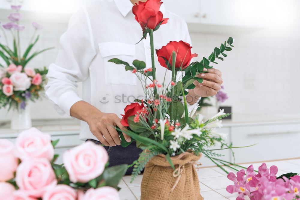 Similar – Image, Stock Photo Female hands with bouquet and vase