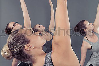 Similar – Image, Stock Photo Women doing stretch exercises in fitness class