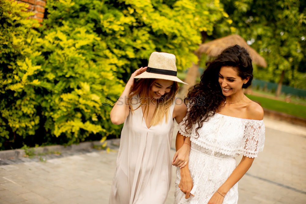 Similar – Image, Stock Photo Two young women looking at an smart phone outdoors