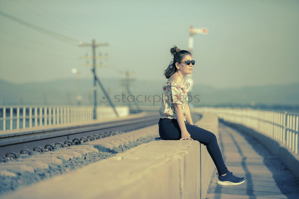 Similar – Barefoot black woman with afro hairstyle sitting on a bench